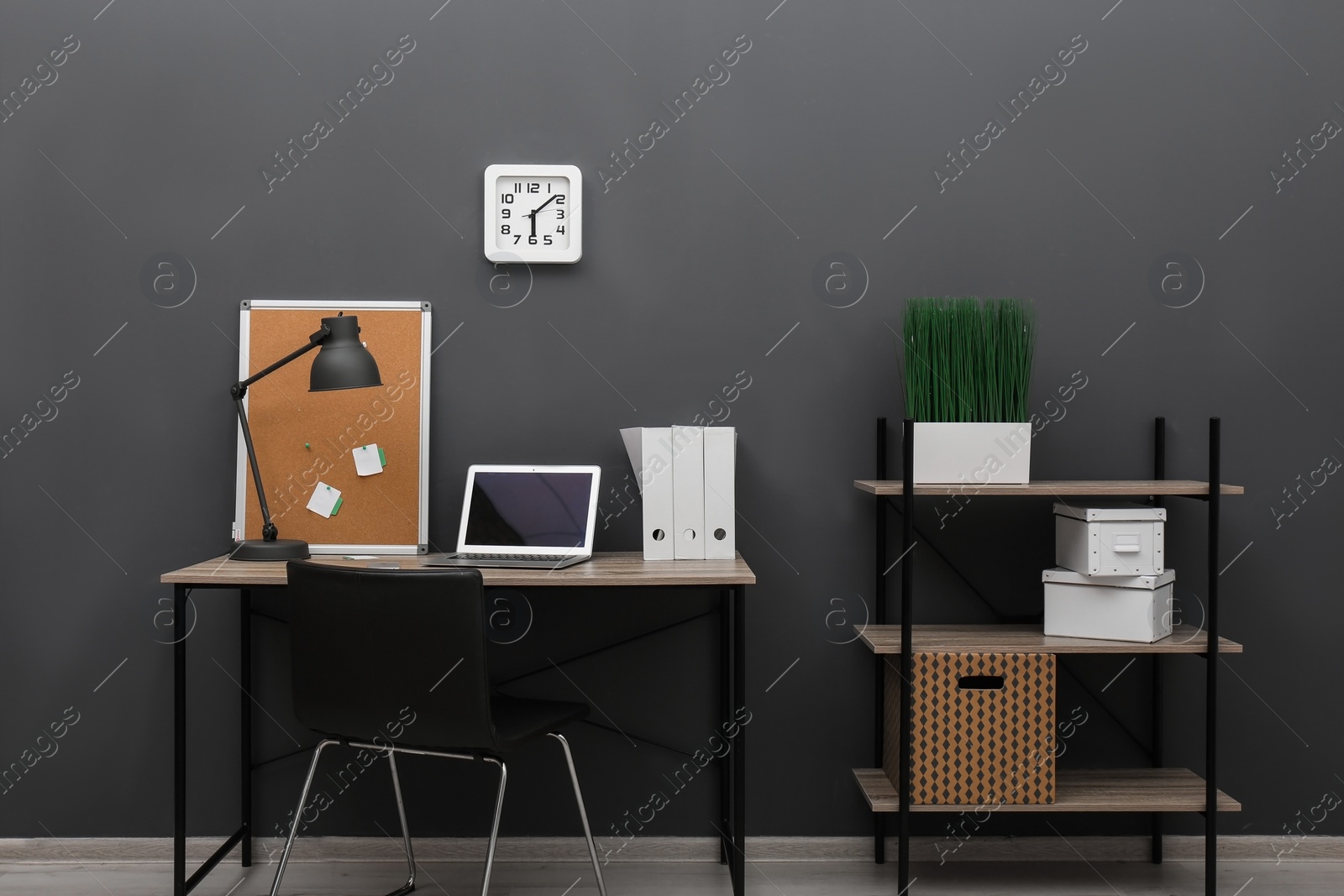 Photo of Interior of stylish workplace with modern laptop in home office