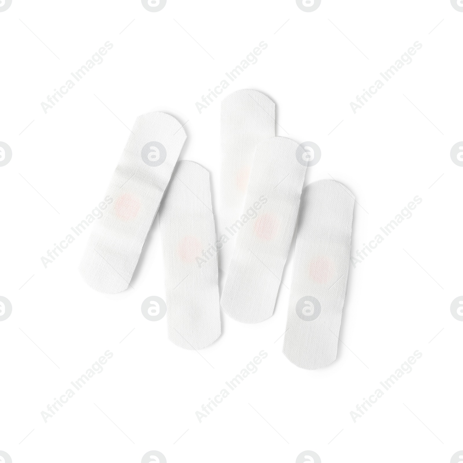 Medical sticking plasters isolated on white. First aid item Photo of Medical sticking plasters isolated on white. First aid item