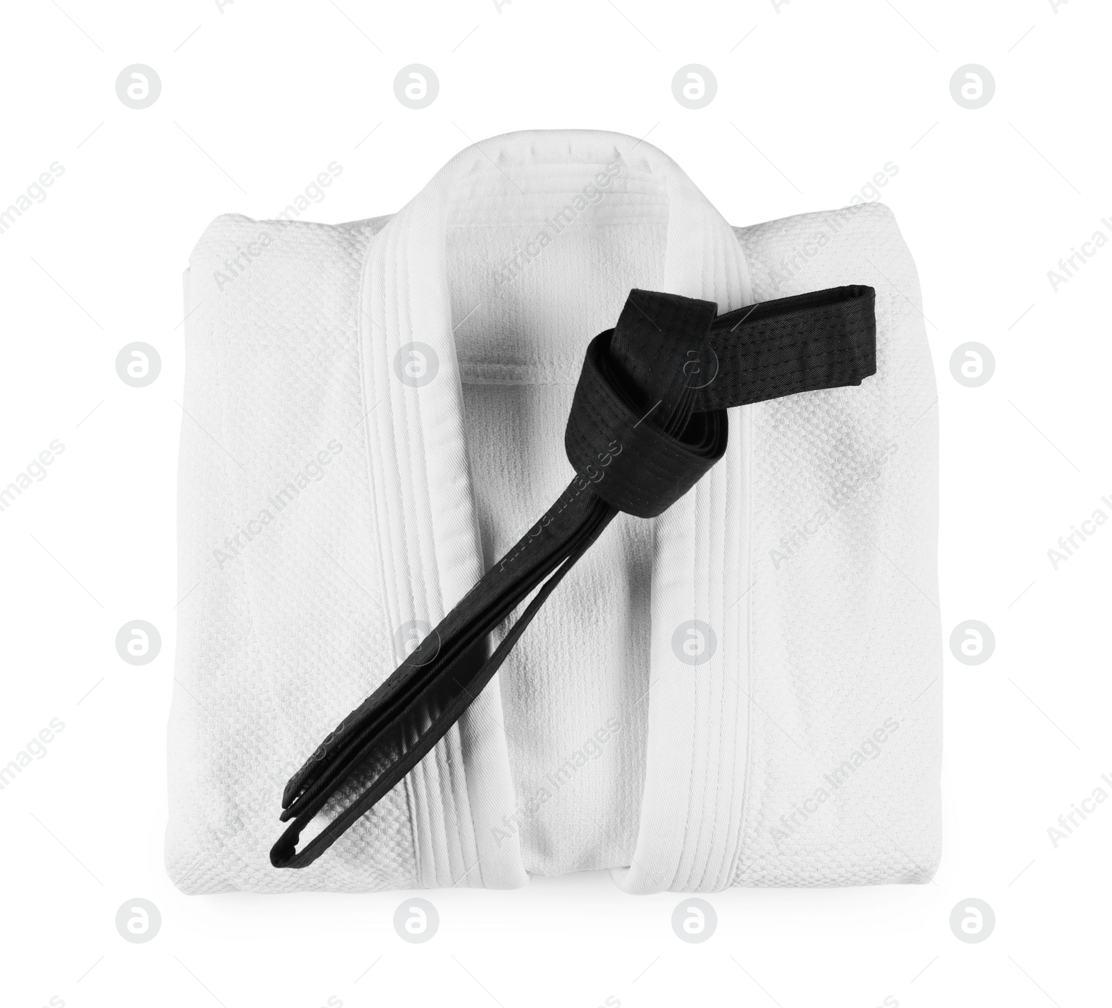 Photo of Martial arts uniform with black belt isolated on white, top view