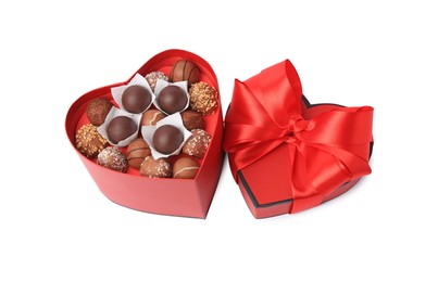 Photo of Heart shaped box with delicious chocolate candies isolated on white