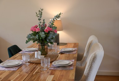 Photo of Beautiful table setting with bouquet and candles in room. Space for text