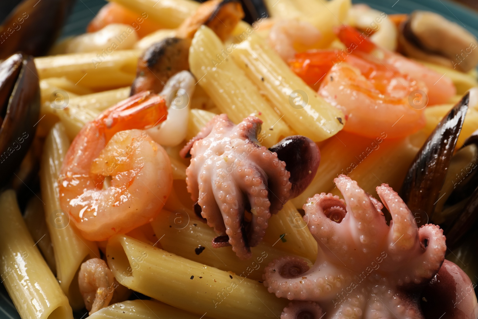 Photo of Delicious pasta with seafood as background, closeup