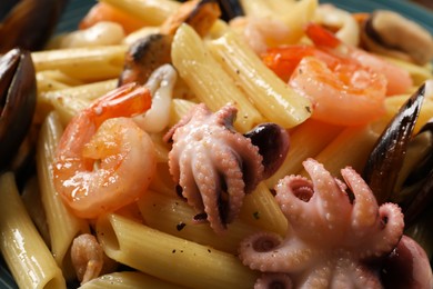 Delicious pasta with seafood as background, closeup