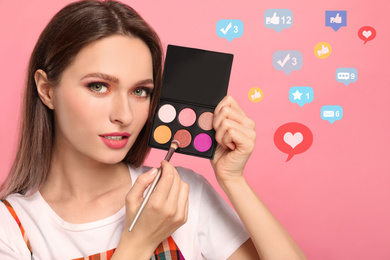 Image of Beauty blogger with brush and eyeshadow palette on pink background