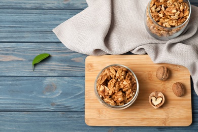 Flat lay composition with walnuts and space for text on wooden background