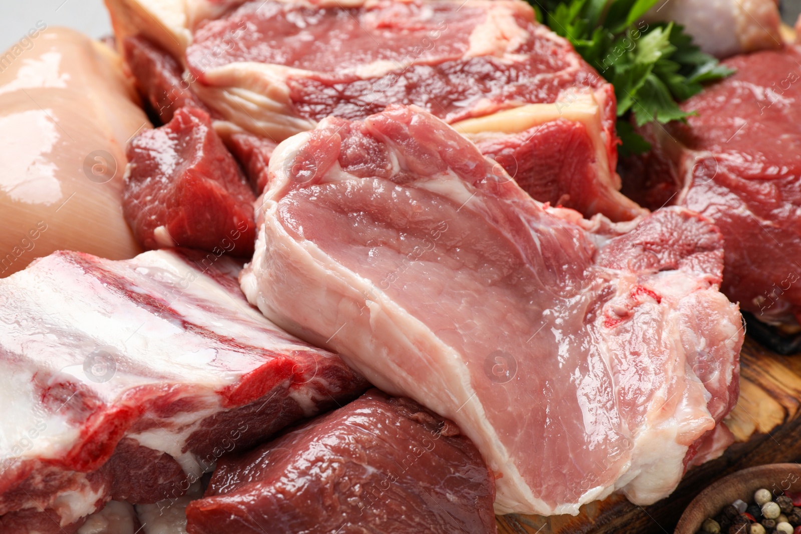 Photo of Closeup view of fresh cut raw meat on table