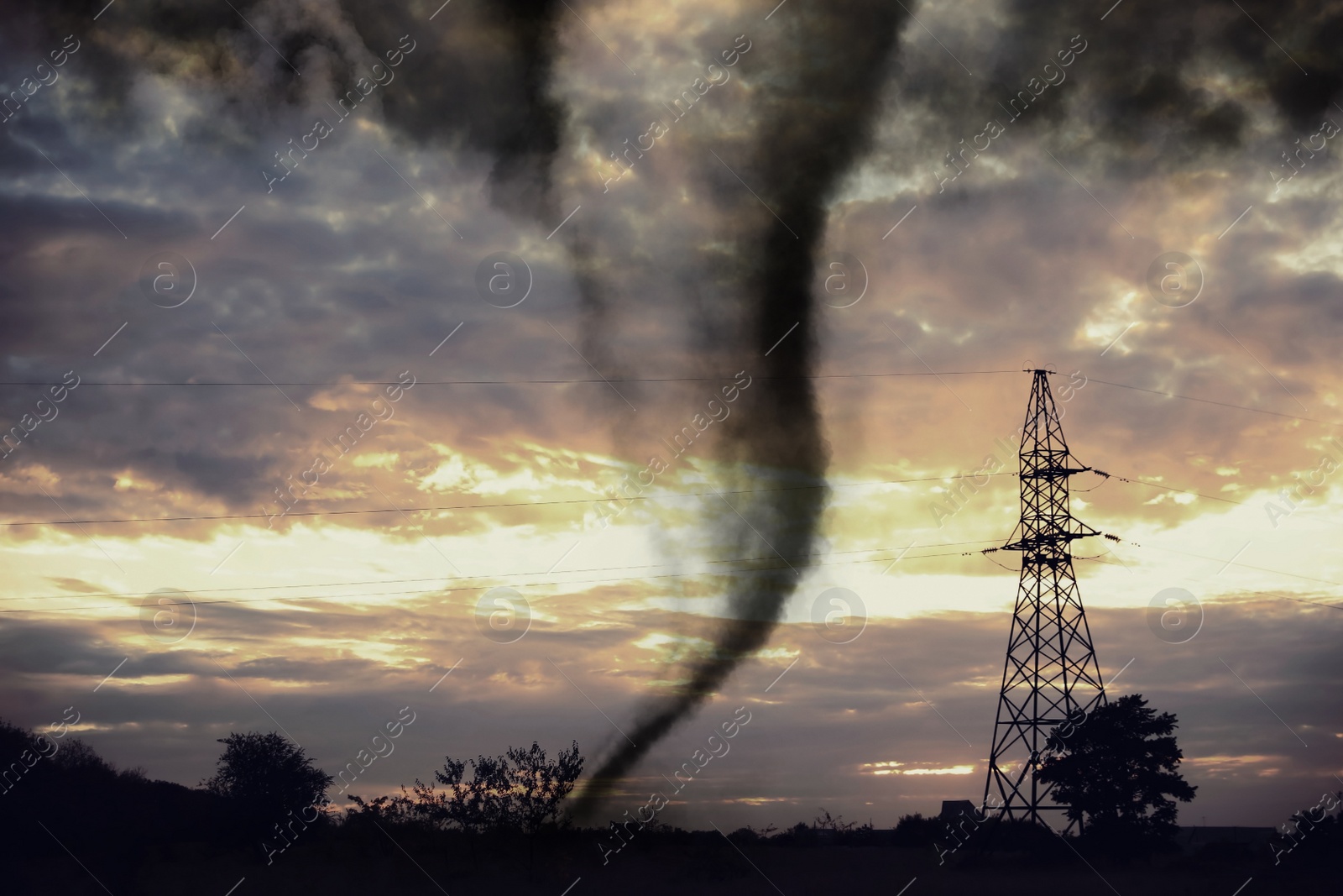 Image of Dangerous whirlwind near transmission tower at field. Weather phenomenon