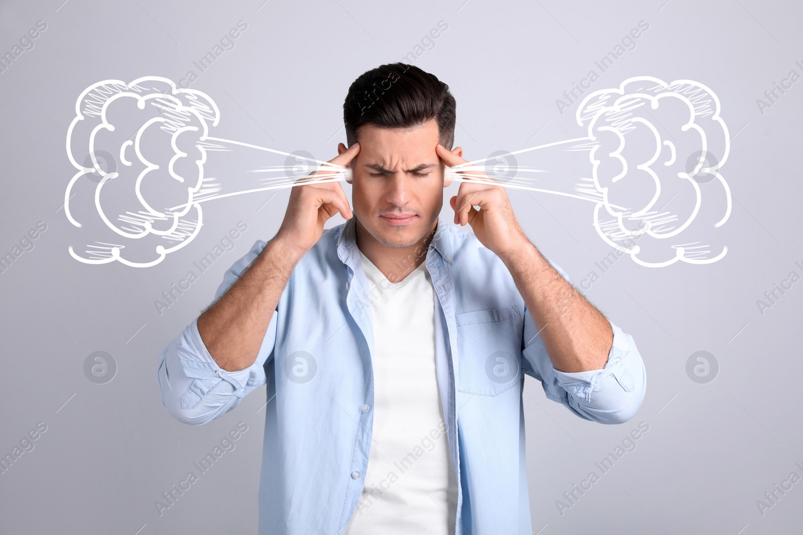 Image of Stressed and upset young man on light grey background
