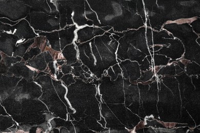 Texture of black marble stone surface as background, closeup