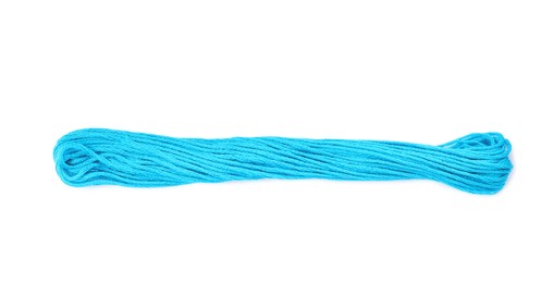 Photo of Light blue embroidery thread on white background