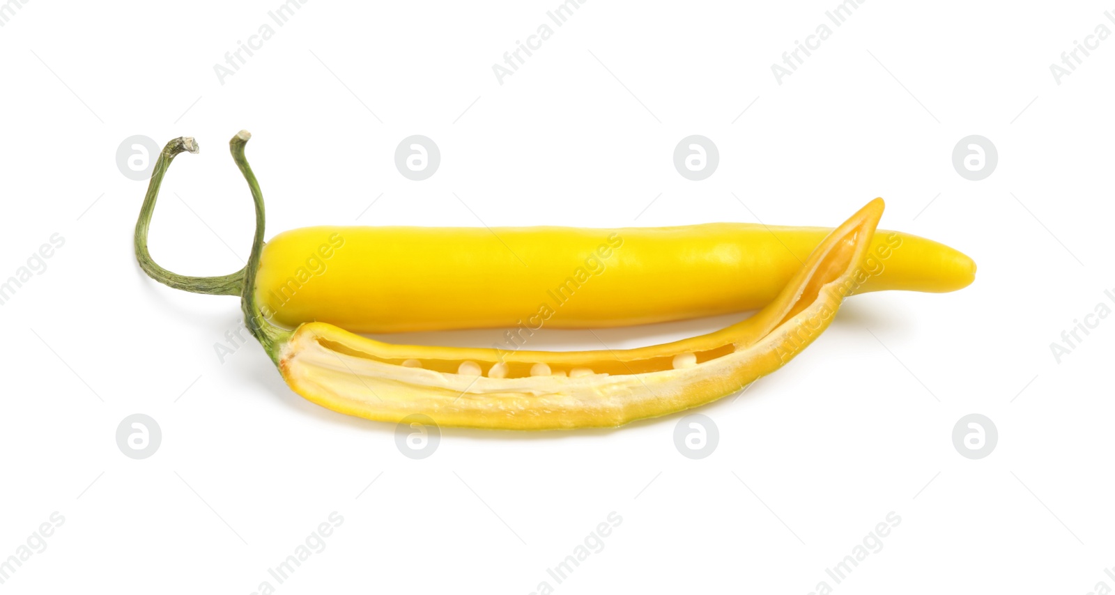 Photo of Cut and whole ripe yellow chili peppers isolated on white