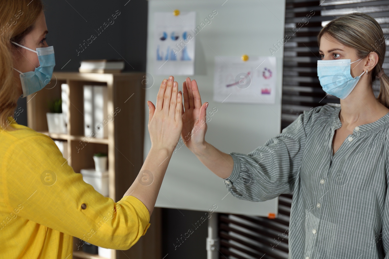 Photo of People refusing handshake in office during coronavirus outbreak