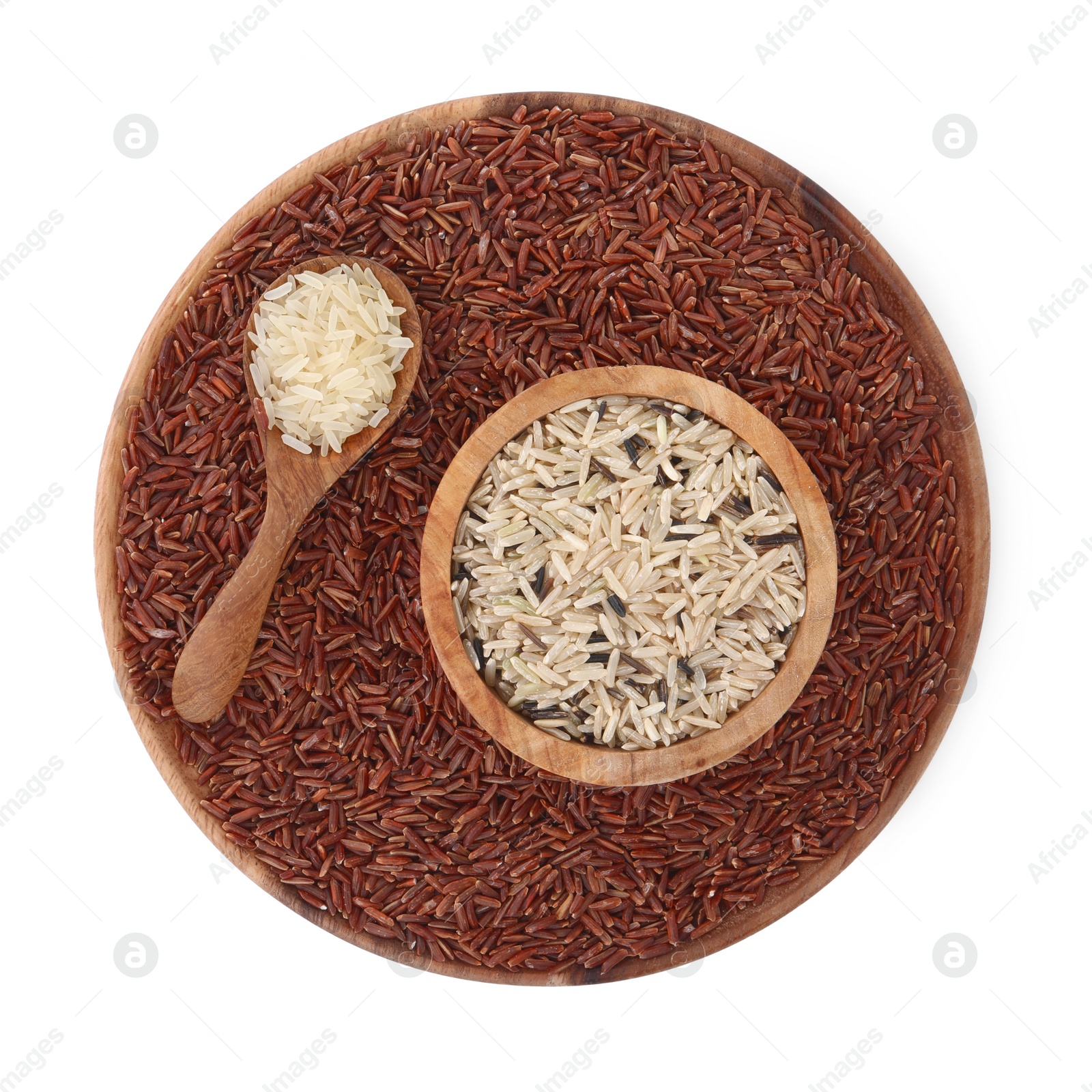 Photo of Bowls and spoon with different sorts of rice isolated on white, top view