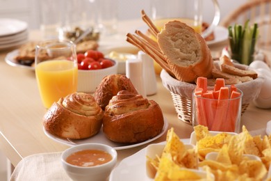 Dishes with different food on table in room. Luxury brunch