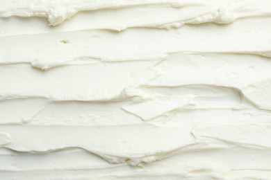 Closeup of tasty cream cheese as background, top view