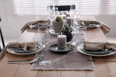 Festive table setting with beautiful tableware and decor indoors