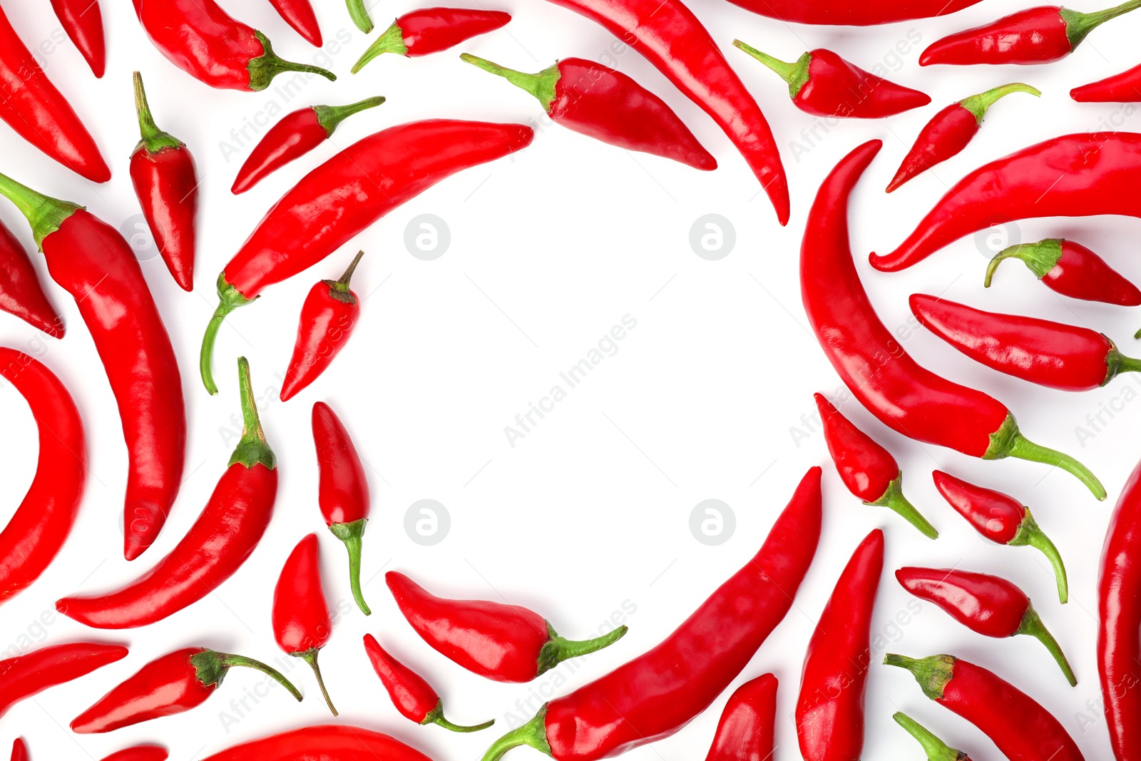 Photo of Frame made of red chili peppers on white background, top view. Space for text