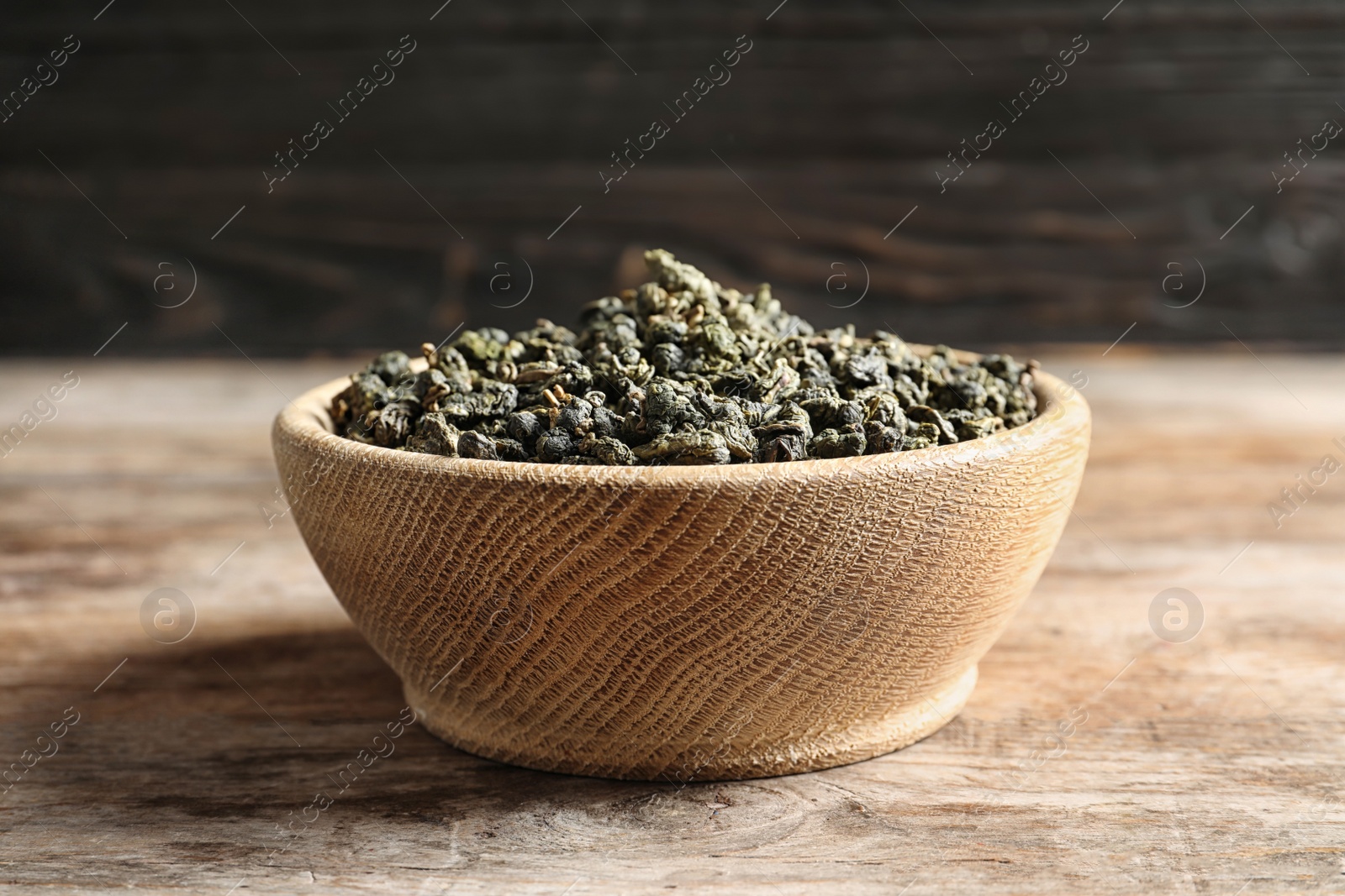 Photo of Bowl of Tie Guan Yin oolong tea leaves on table