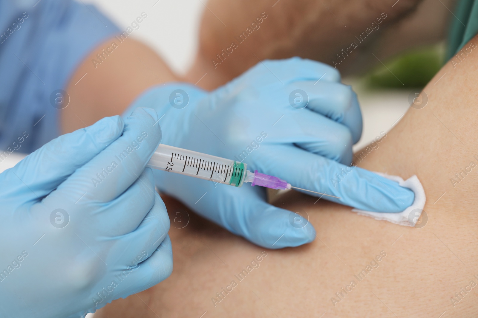 Photo of Doctor giving hepatitis vaccine to patient on white background, closeup