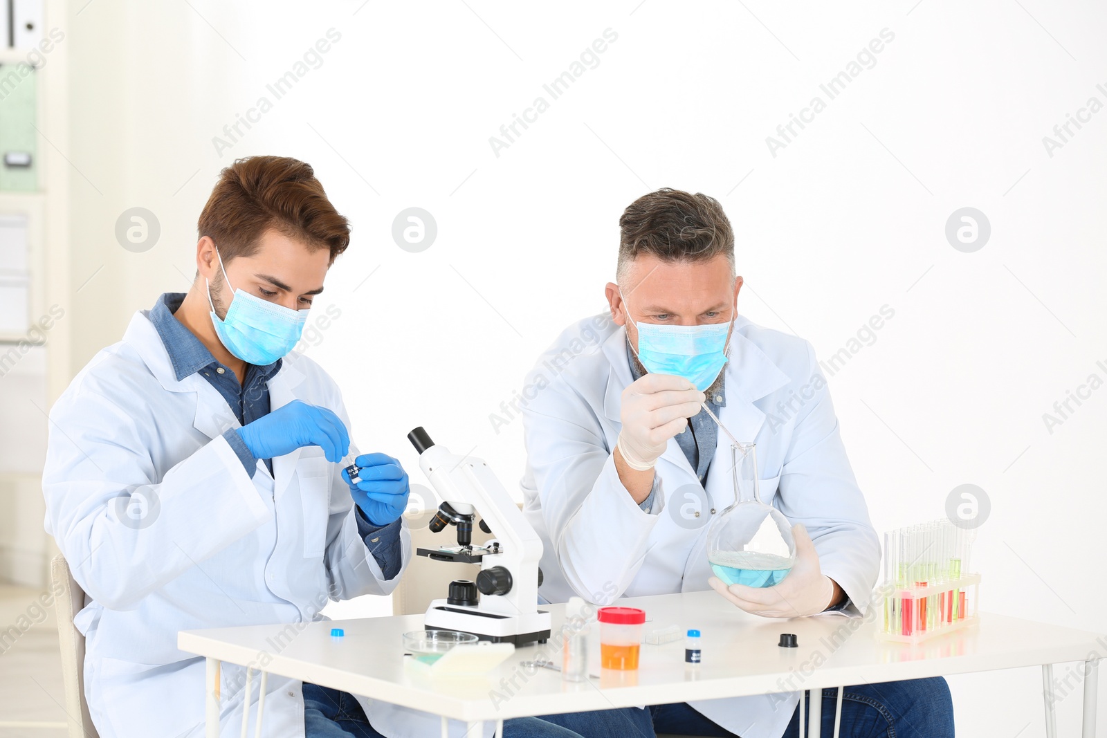 Photo of Scientists working in laboratory. Research and analysis