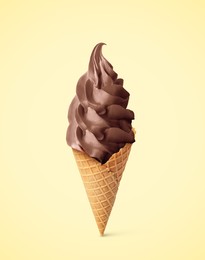 Delicious soft serve chocolate ice cream in crispy cone on beige background