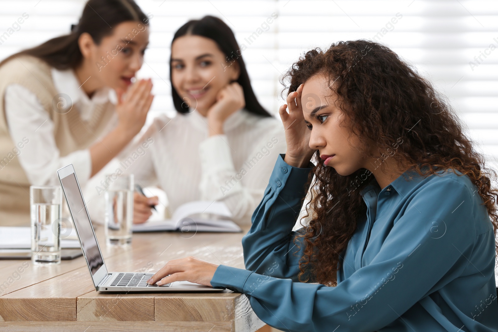 Photo of African American woman suffering from racial discrimination at work