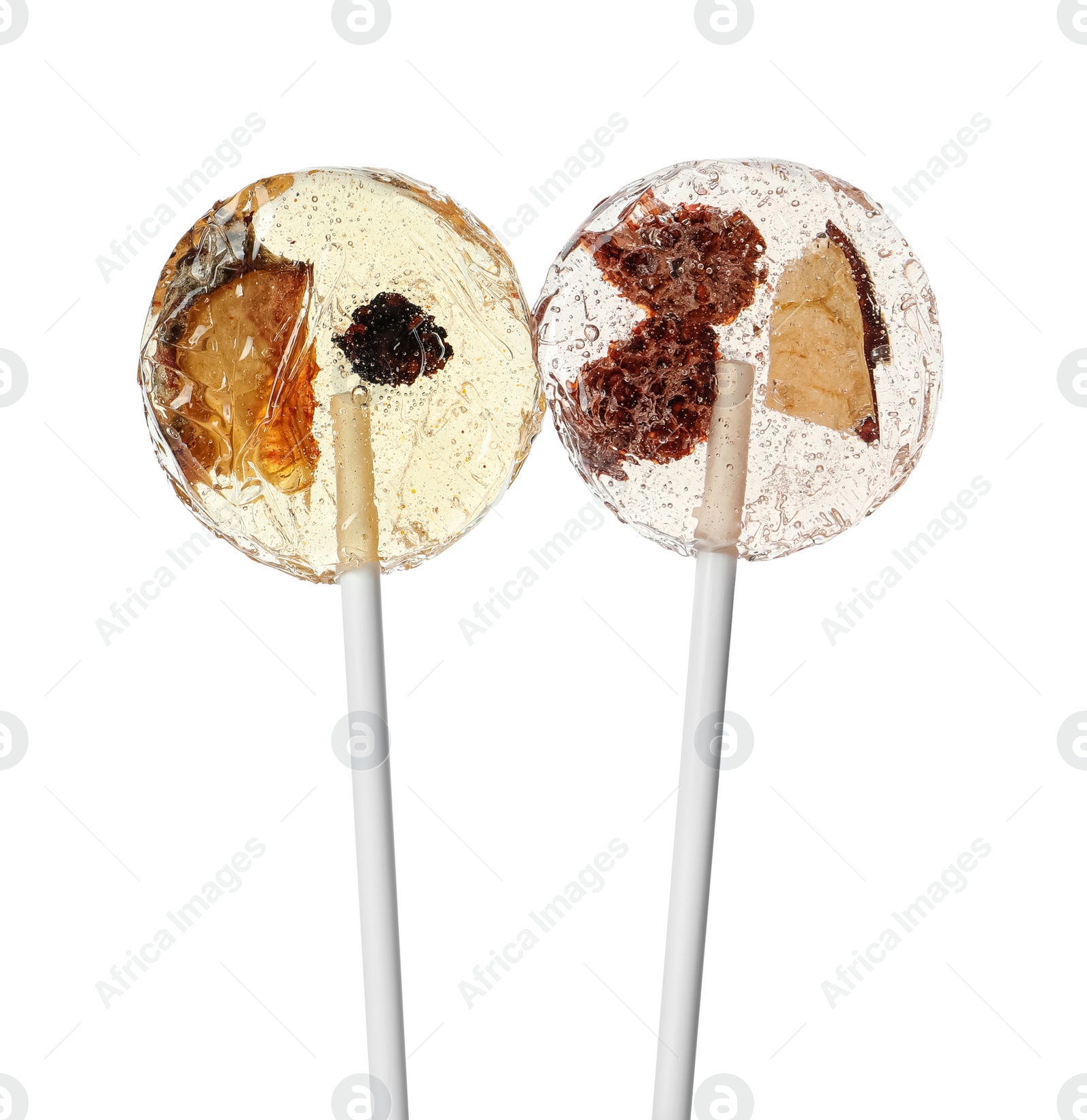 Photo of Sweet colorful lollipops with berries on white background