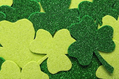 Decorative clover leaves as background, top view. St. Patrick's Day celebration