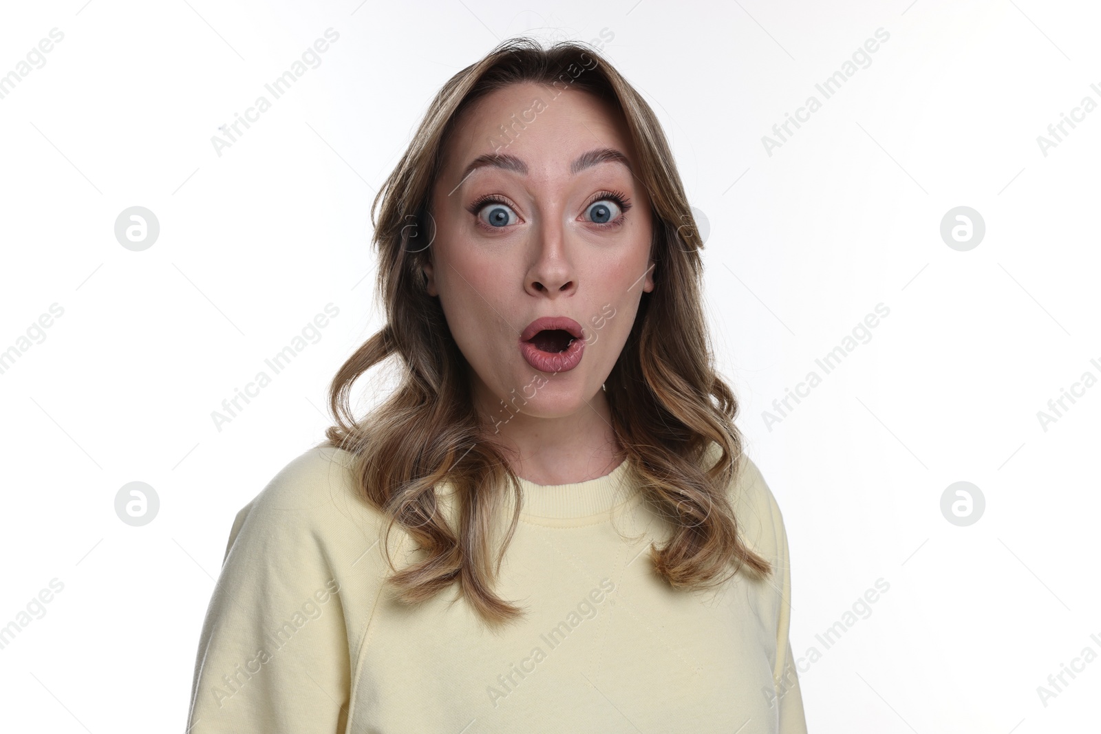 Photo of Portrait of surprised woman on white background