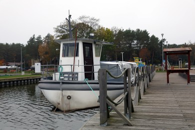 Picturesque view of wooden pier with moored boat
