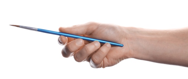 Photo of Man holding paint brush on white background, closeup