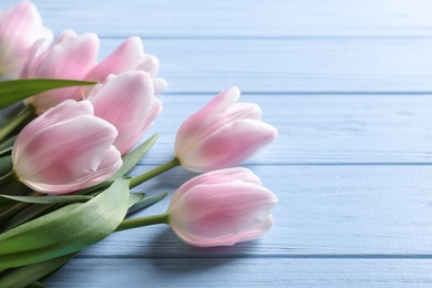 Beautiful tulips for Mother's Day on wooden background