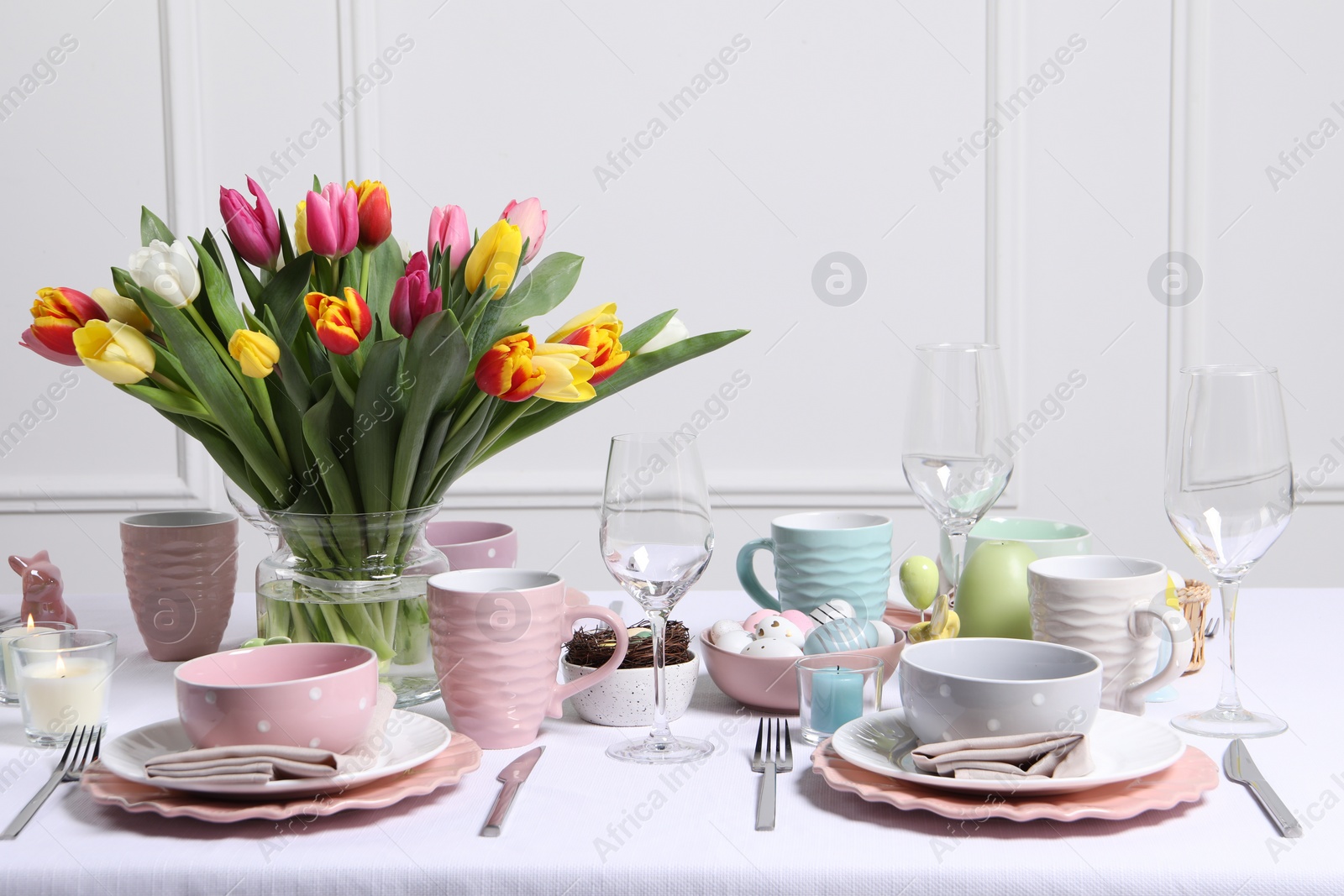 Photo of Festive table setting with beautiful flowers. Easter celebration