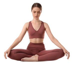 Beautiful young woman meditating on white background