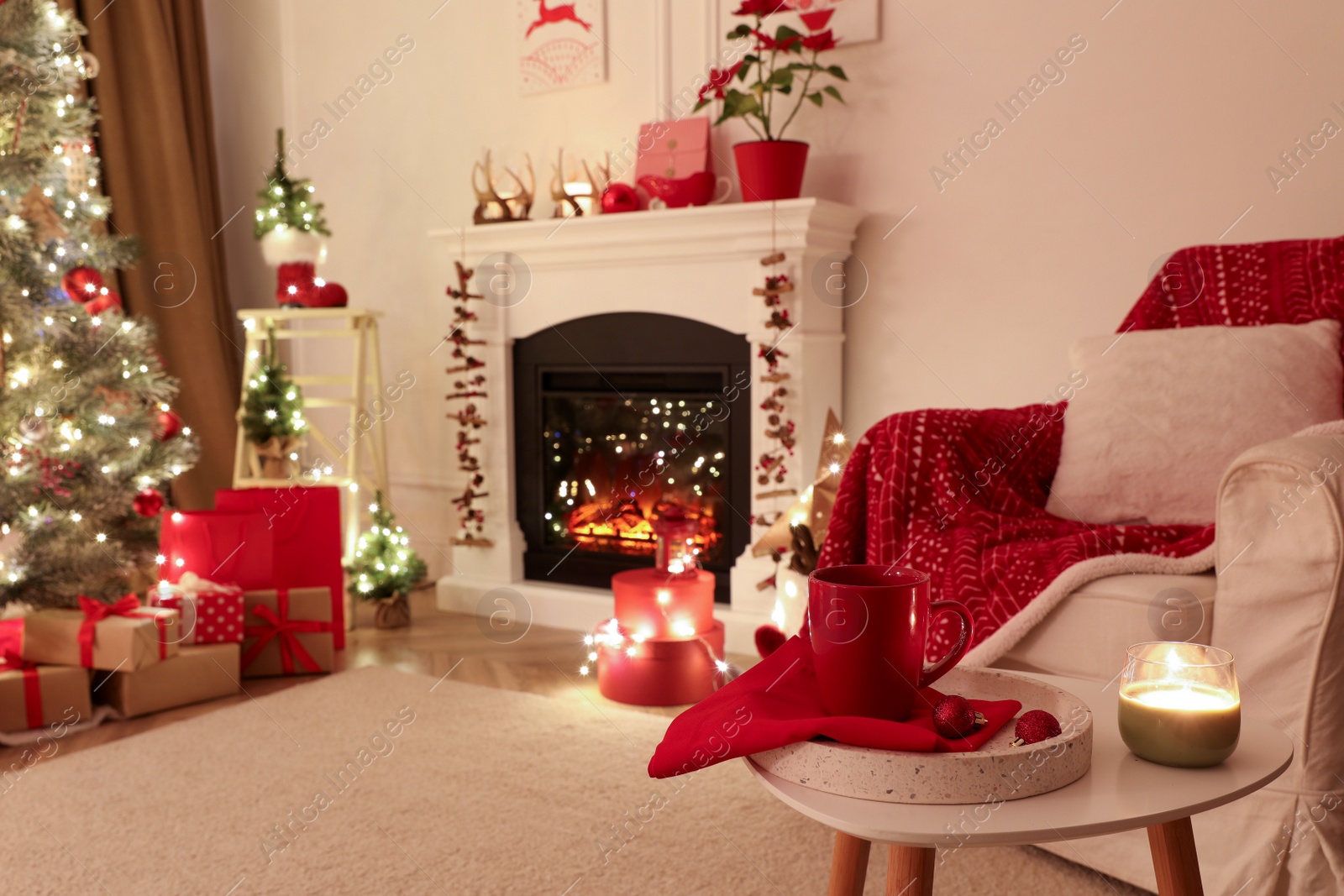 Photo of Living room with fireplace and Christmas decorations. Festive interior design