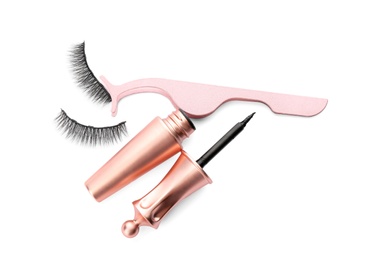 Photo of Magnetic eyelashes, eyeliner and tweezers on white background