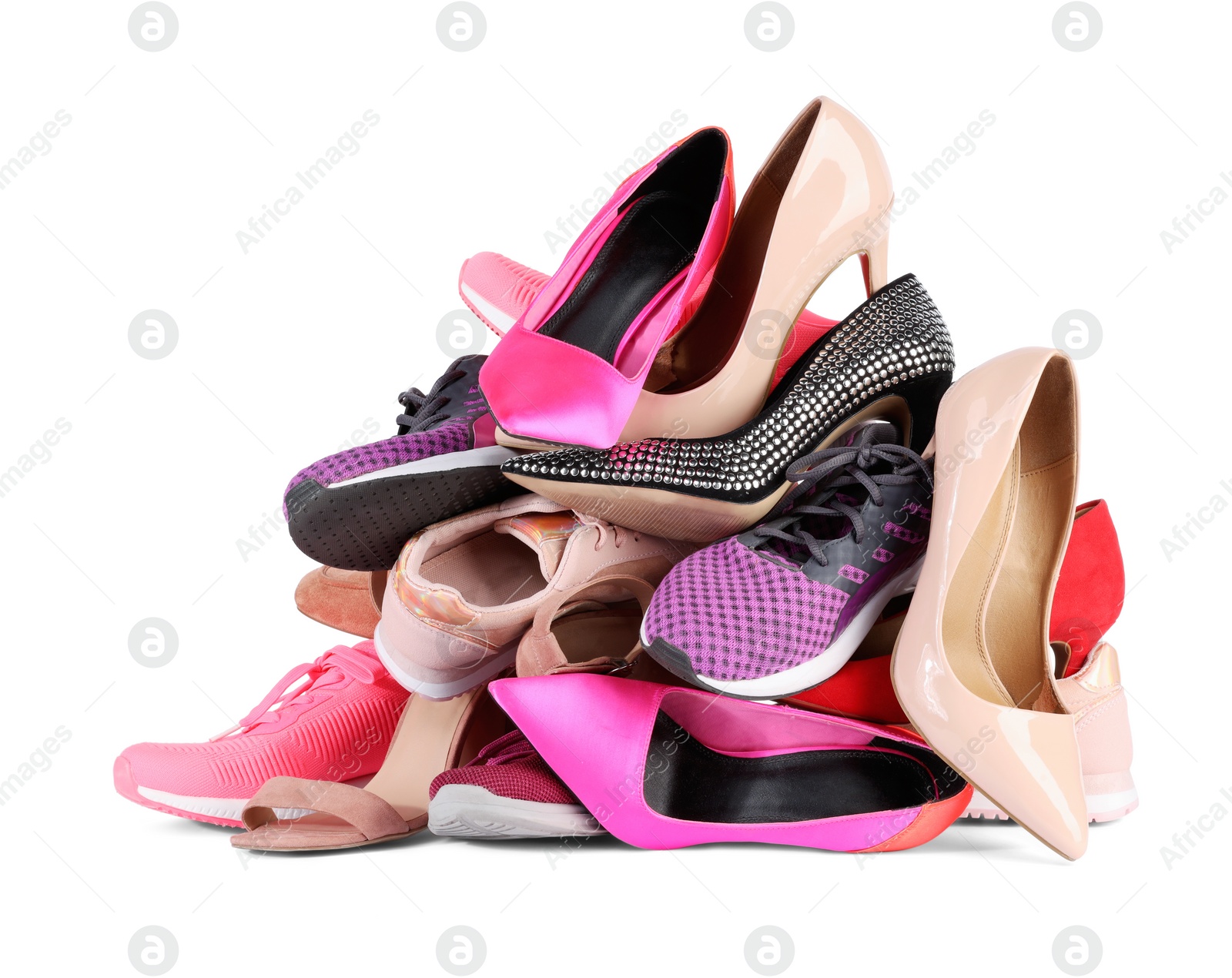 Photo of Pile of different female shoes isolated on white