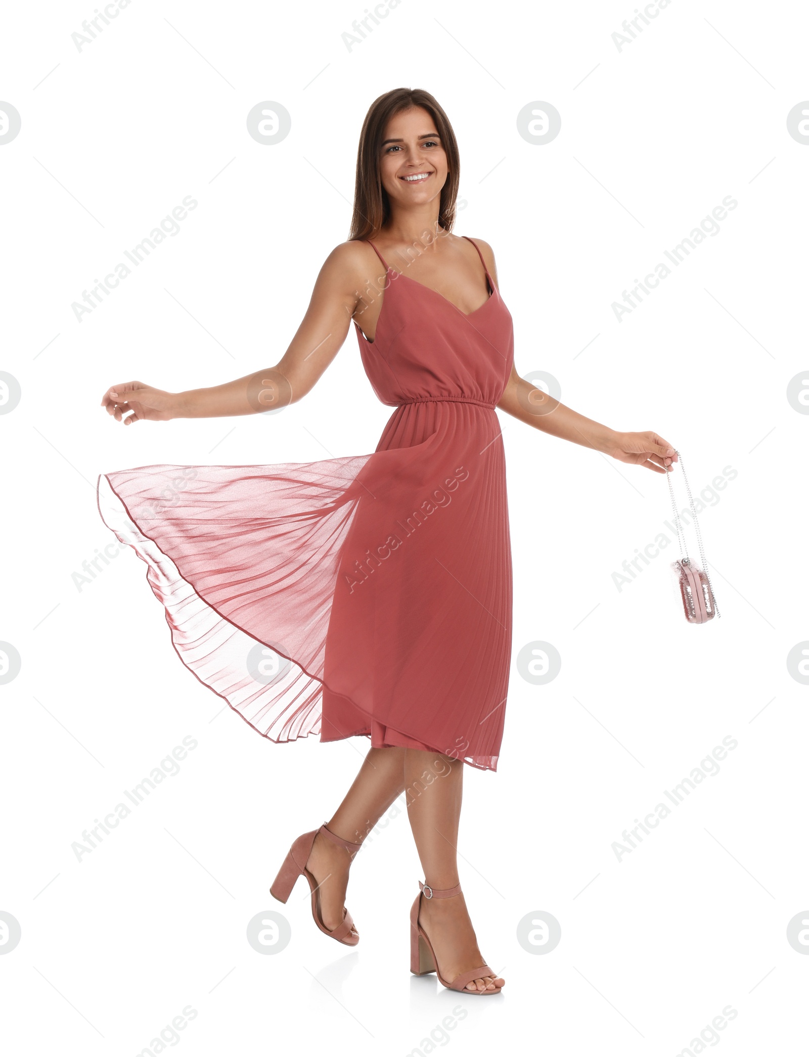 Photo of Young woman wearing stylish pale pink dress on white background