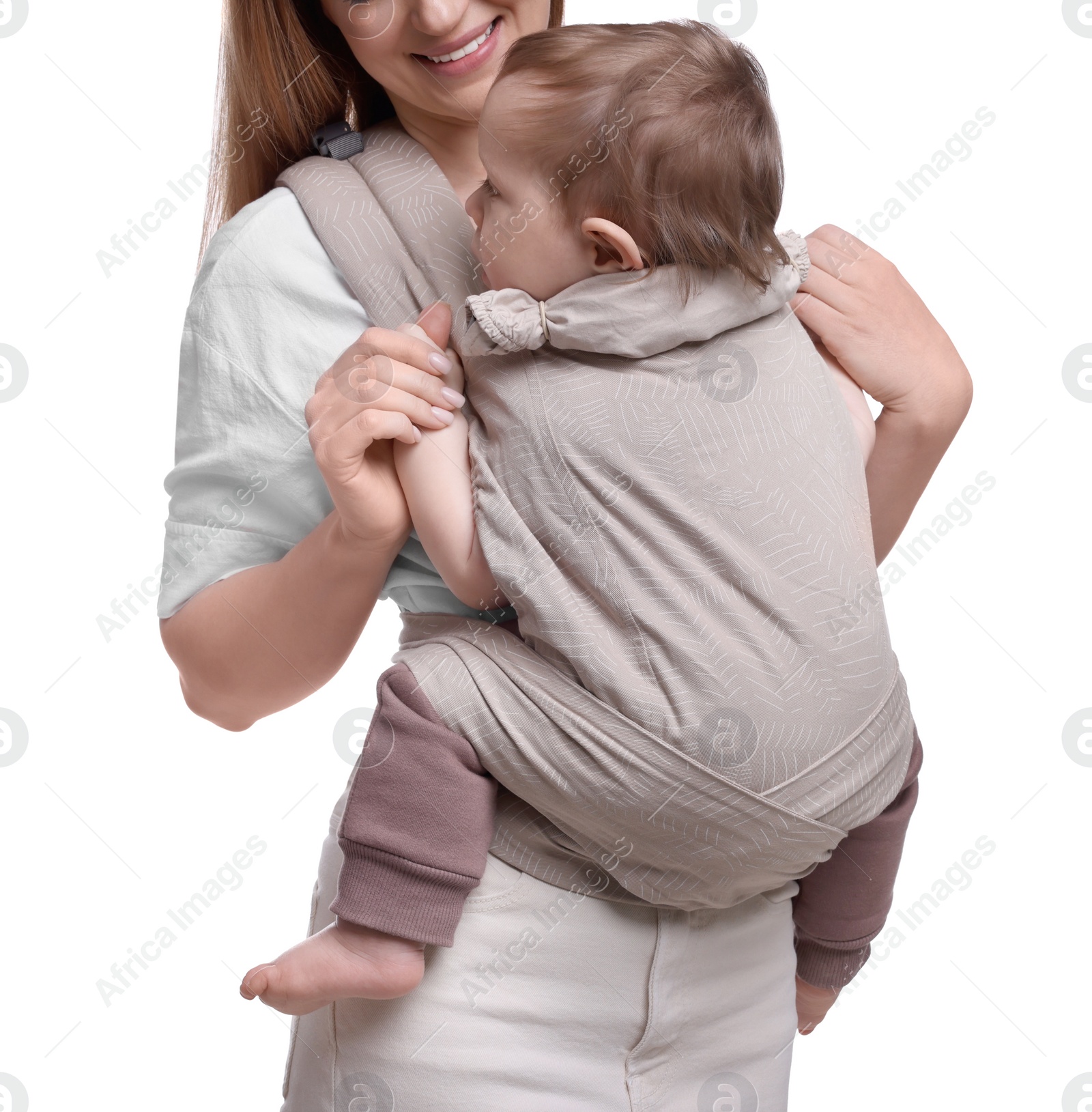 Photo of Mother holding her child in sling (baby carrier) on white background, closeup