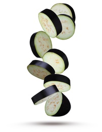 Image of Cut fresh eggplant pieces falling on white background