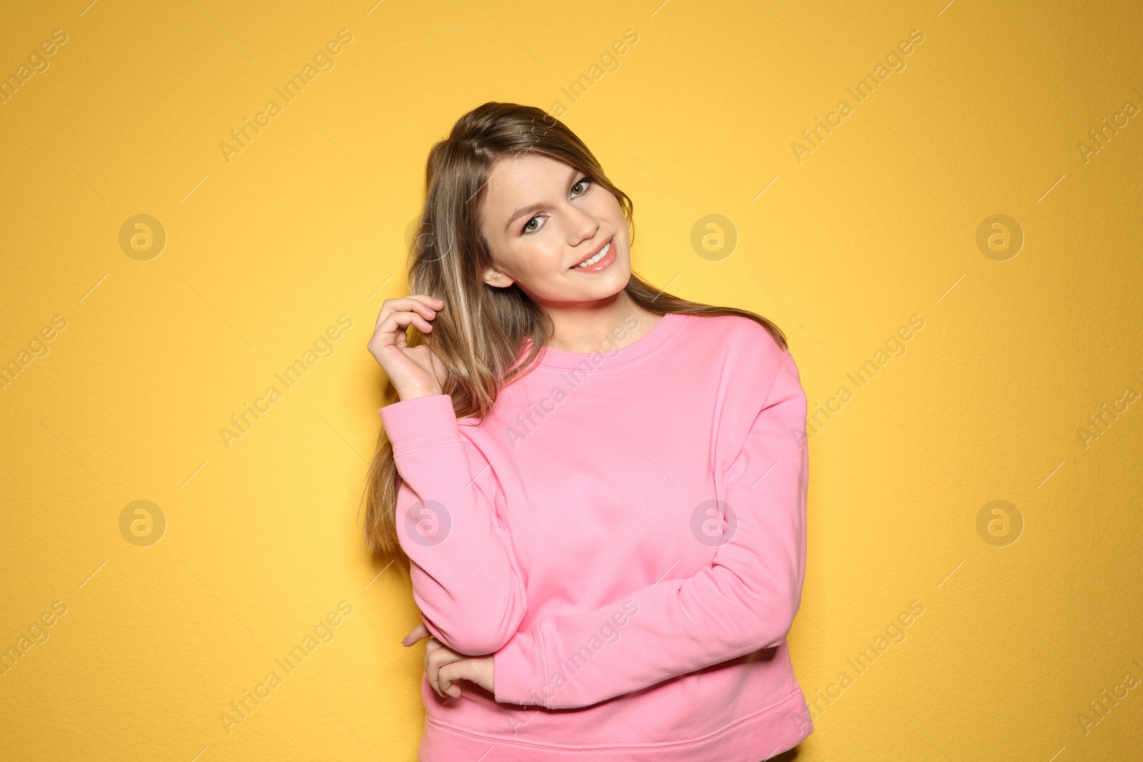 Photo of Portrait of beautiful young woman on color background