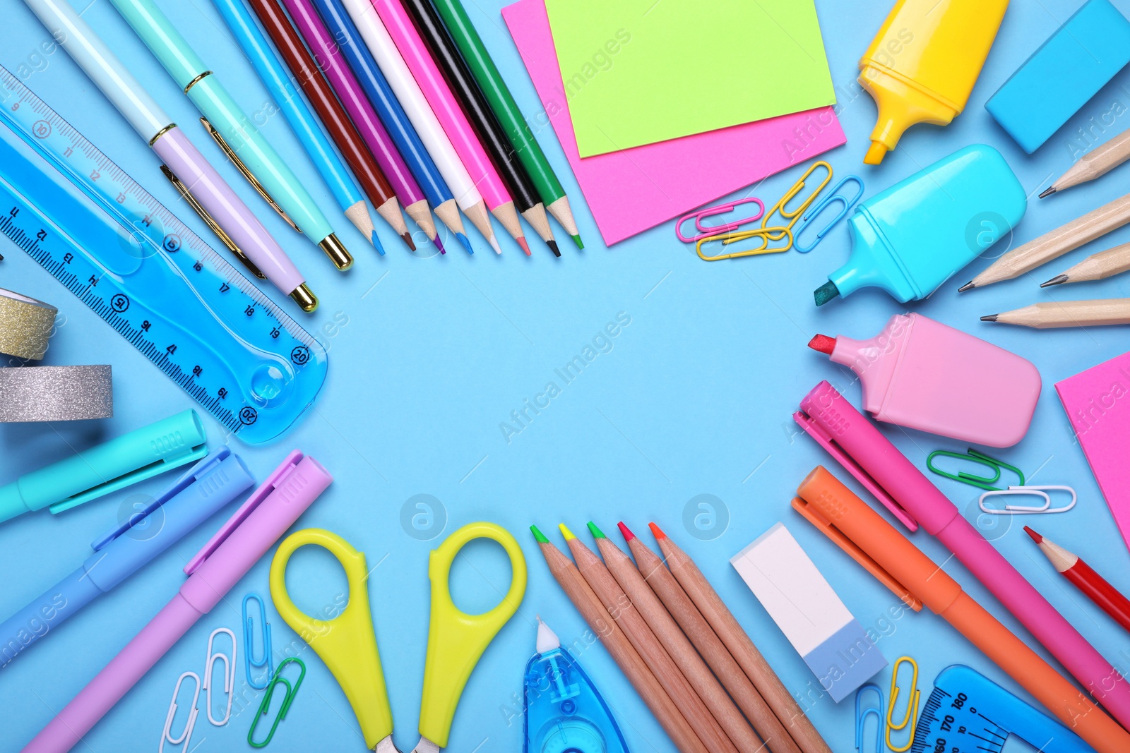 Photo of Back to school. Frame of different school stationery on light blue background, flat lay. Space for text