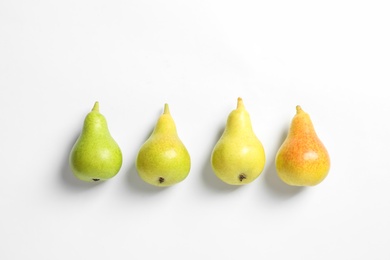 Photo of Ripe juicy pears on white background, top view