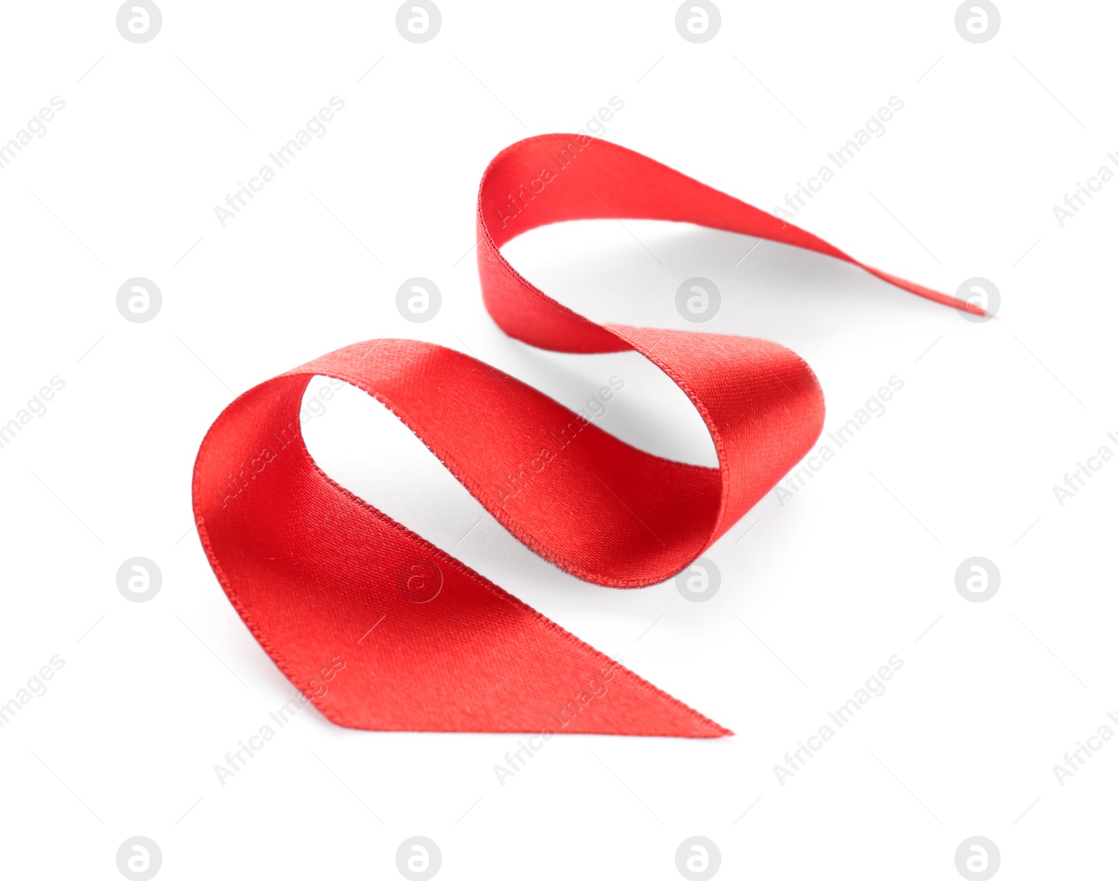 Photo of Simple red ribbon on white background. Festive decoration