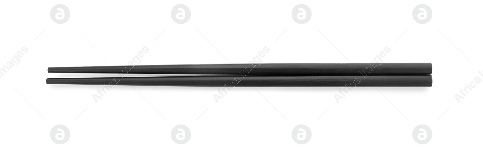 Photo of Pair of black chopsticks isolated on white, top view