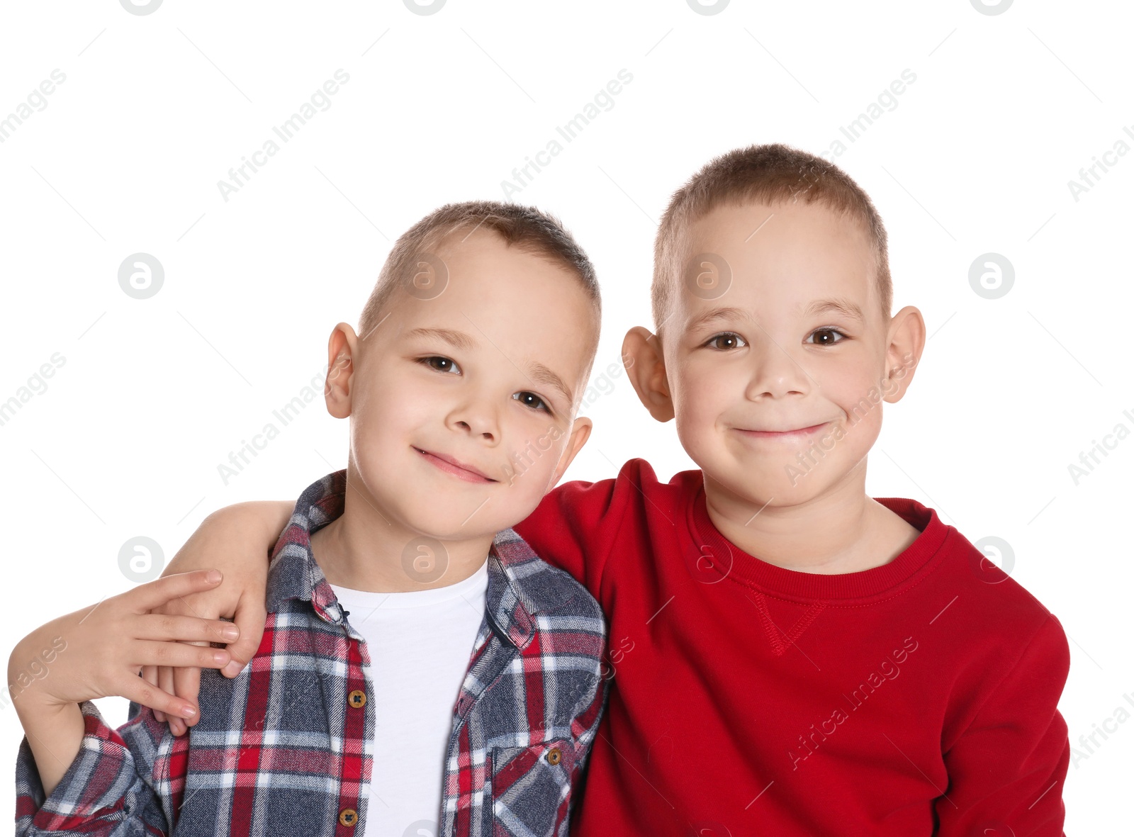 Photo of Portrait of cute twin brothers on white background