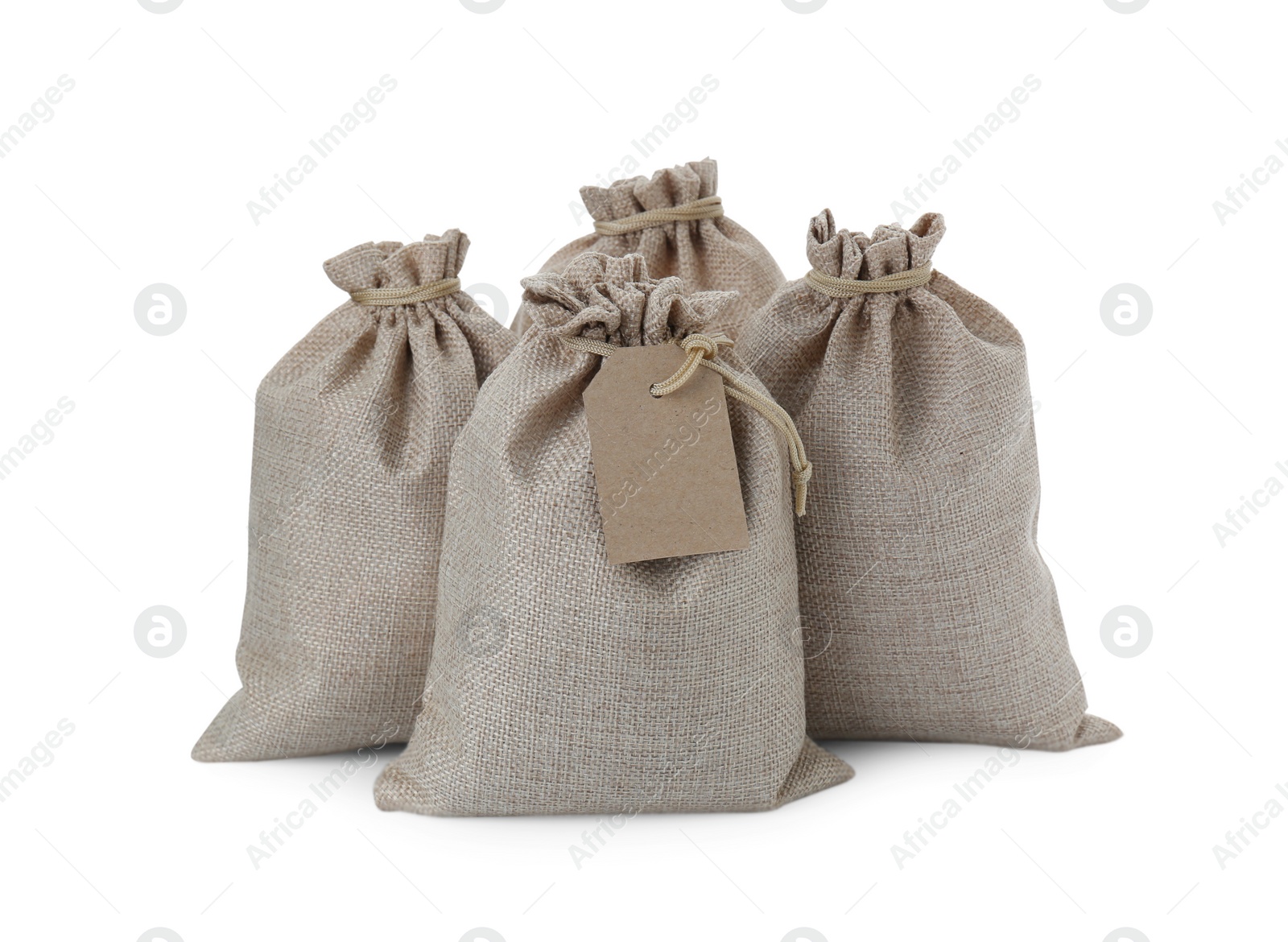 Photo of Many tied burlap bags isolated on white