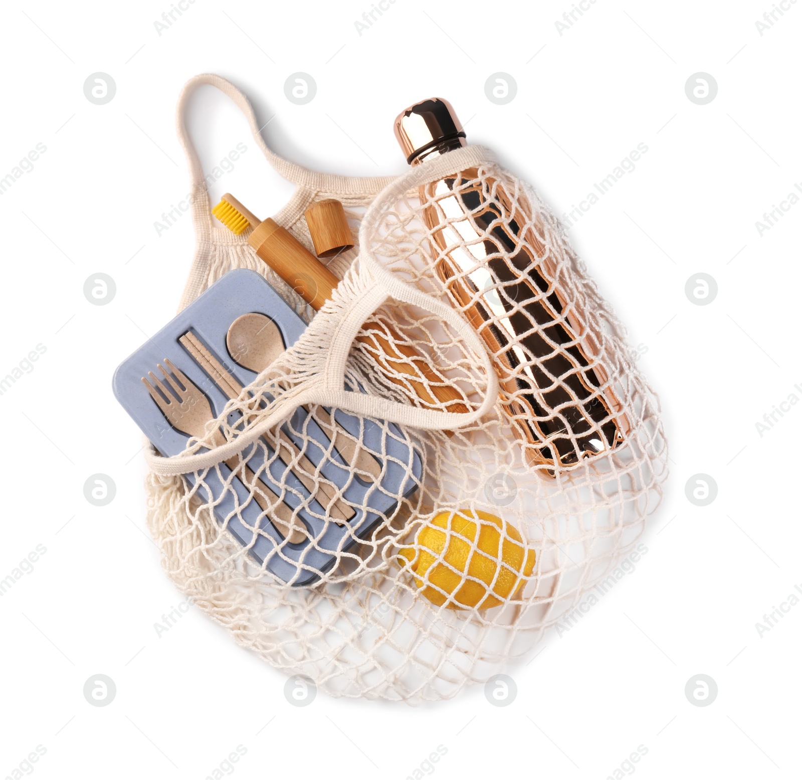 Photo of Mesh bag with different items isolated on white, top view. Conscious consumption