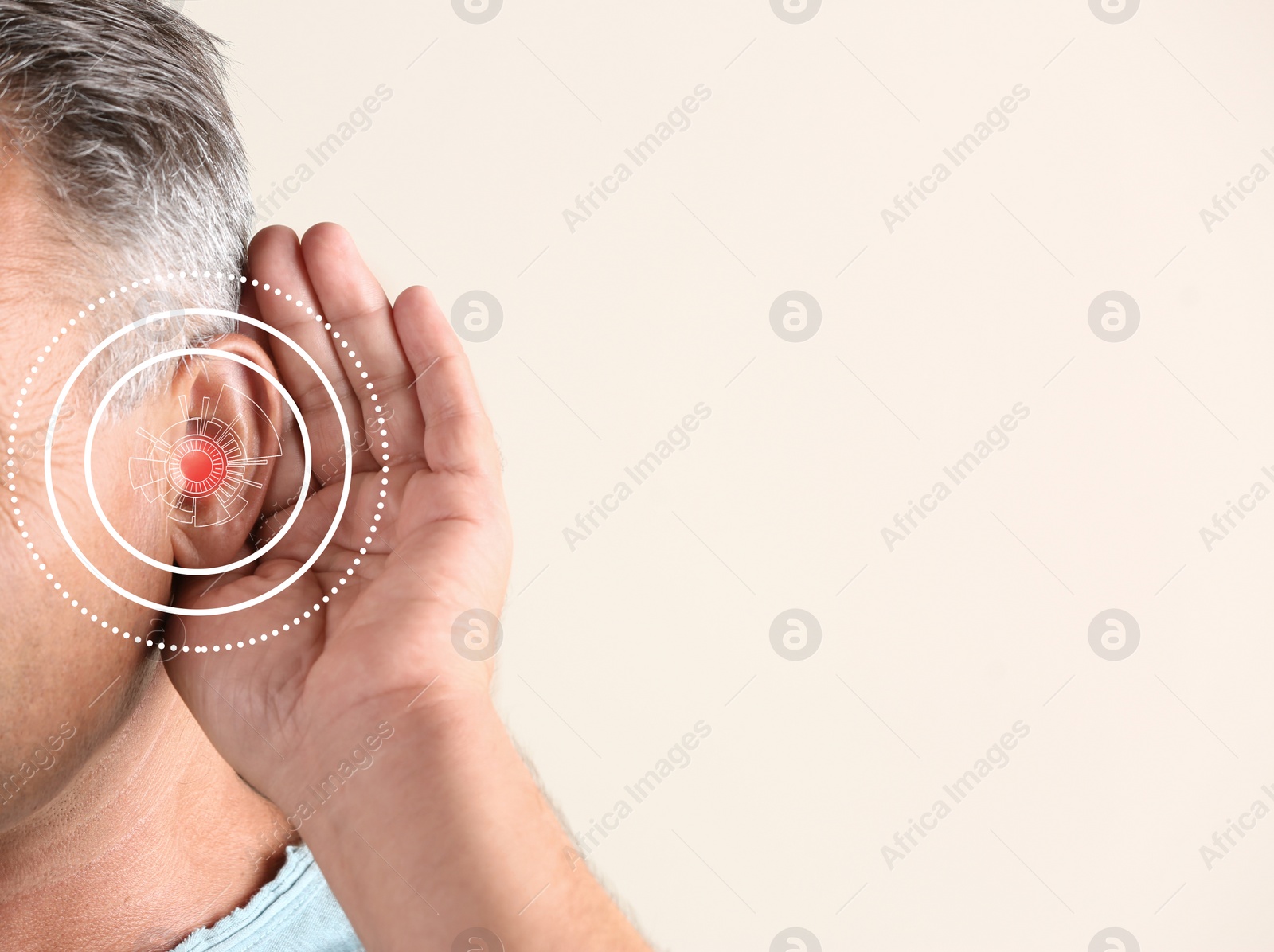 Image of Mature man with hearing problem on light background, closeup. Space for text