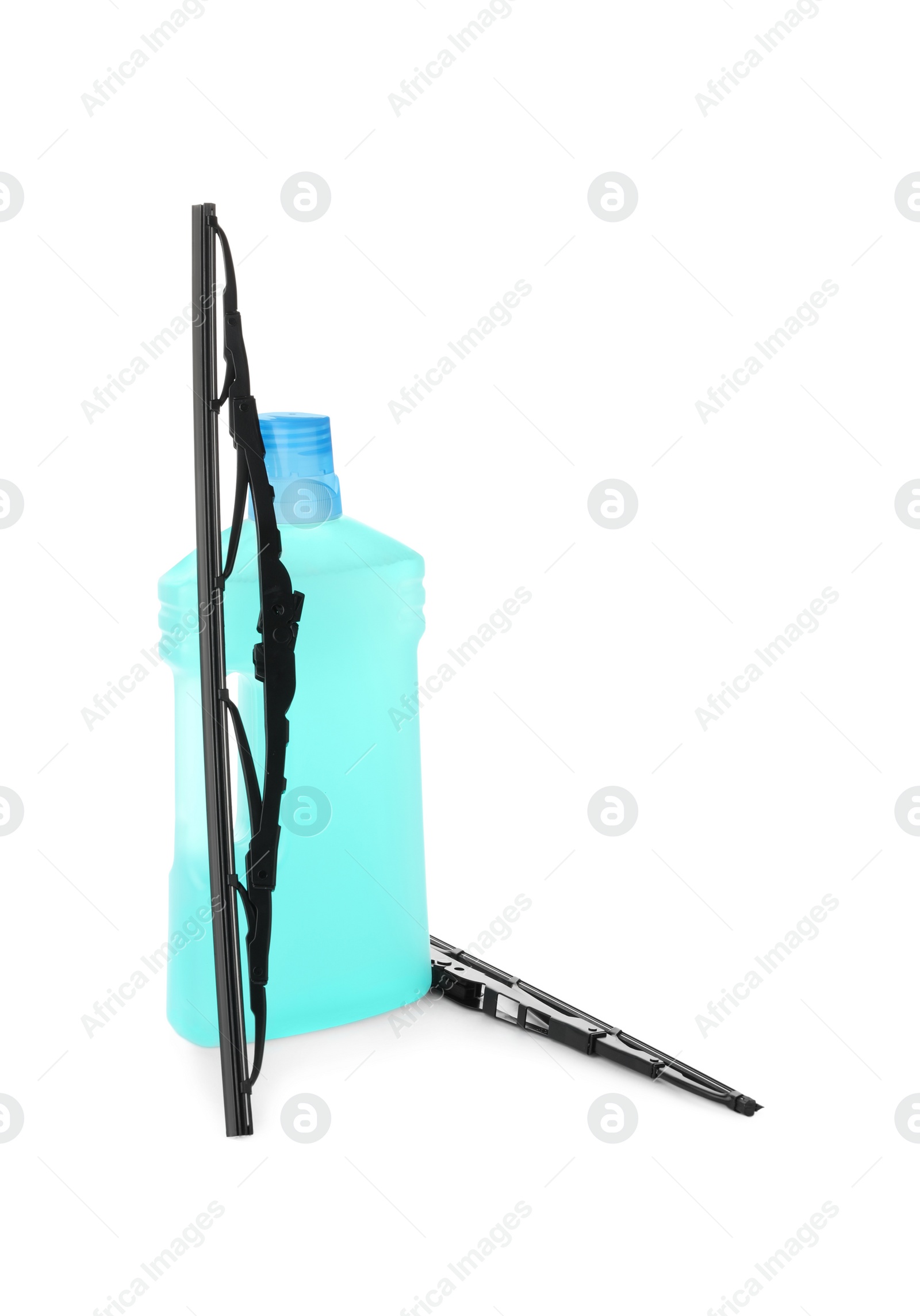 Photo of Bottle of windshield washer fluid and wipers on white background